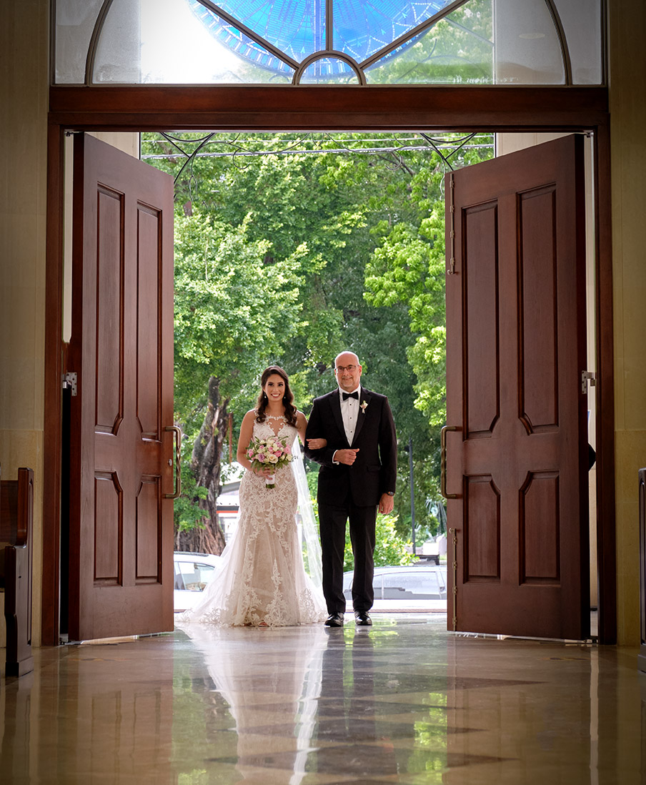 Bride and father walk down the aisle